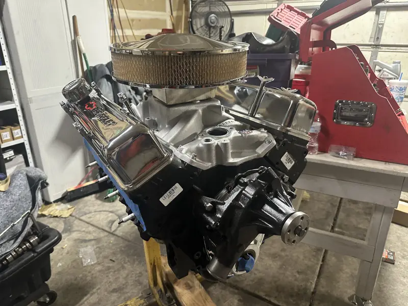 Crate V8 engine on an engine stand in a garage